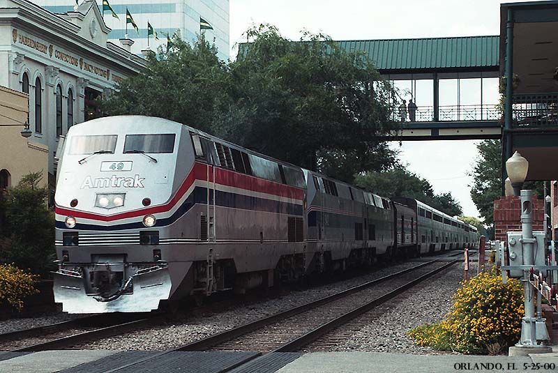 Amtrak 49 coasts past Church Street Station in downtown Orlando, FL on 5-25-00