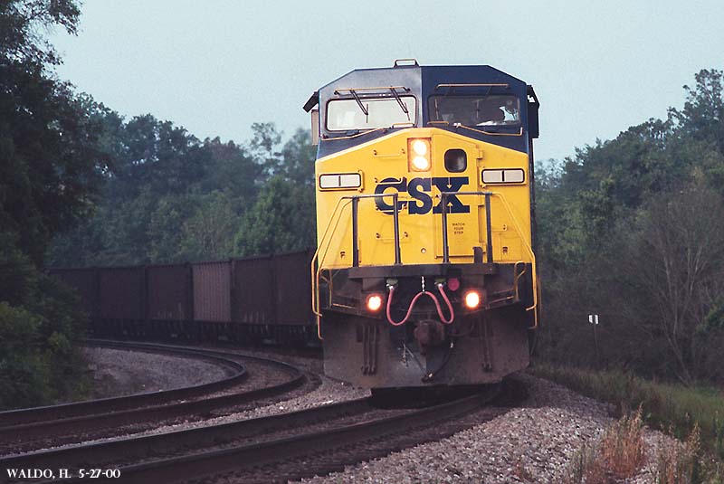 CSX #1 rounds the corner with a northbound load of empty coal cars.