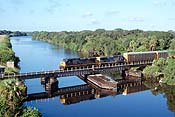 CSX 423 crosses the St. Lucie Canal Swing bridge located just south of Indiantown, FL on October 12, 2002. (259K)