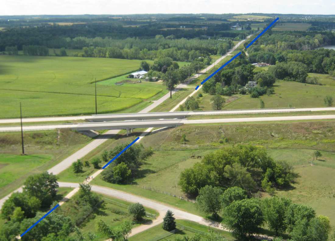 I can squint at the picture and see 4 bicyclists. There is a convenient