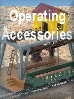 Operating Interactive Accessories for S-Gauge. Includes pictures and videos of remote controlled loaders, cranes, buildings, and action cars!