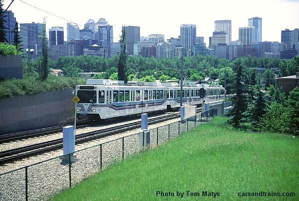 Car 2202 is leading an outbound train up the 9th Street hill on the northwest line