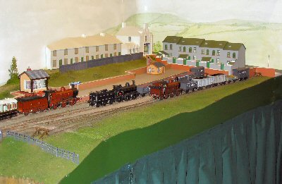 Furness Railway passeneger train coasts into the station