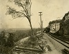 Radial car crossing gravel quarry, just east of present day Scenic drive, date unknown.