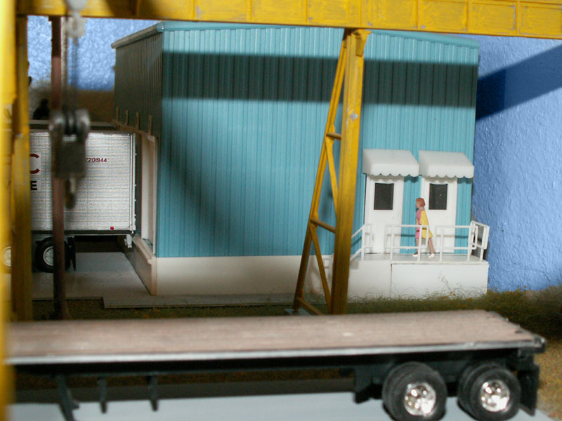 A door for the warehouse and one for the office on a custom built porch