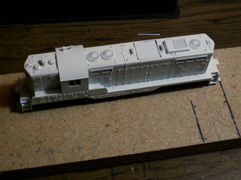 A piece of styrene was measured to fill the hole. A larger piece was cut