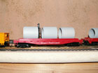 Great Northern flat car with cement pipe