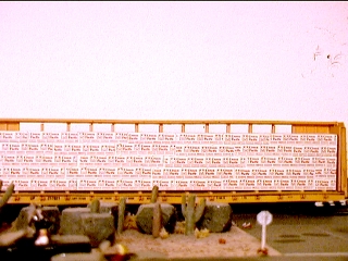 Walthers lumber load on McKean centerbeam flat car