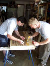John & Matt laying cork track bed on yard module