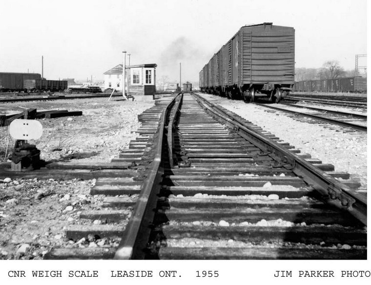 Old style weigh scales. Switch can line cars over "live" rail for