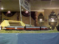 An American Models ALCO pa-pb-pa in New Haven livery passes the American Flyer Circus.