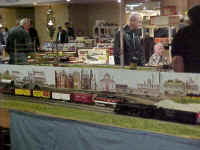 The RASG club's American Models 4-8-4 Northern locomotive is passing a New Haven EP5 that is waiting on the side track.
