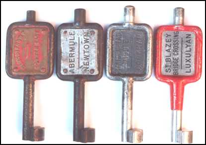 Image of four G.W.R. type key tokens