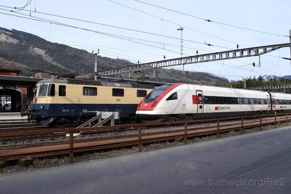 7885-0037-120322.jpg - IRSI Re 421.387-2 / Re 4/4'' 11387 (Re 91 85 4 421 387-2 CH-IRSI) + SBB-CFF ICN RABe 500.037 / Bt ICN 94 85 1 500.037-0 ''Grock'' (RABe 94 85 0 500 037-2 CH-SBB) / Arth-Goldau 12.3.2022