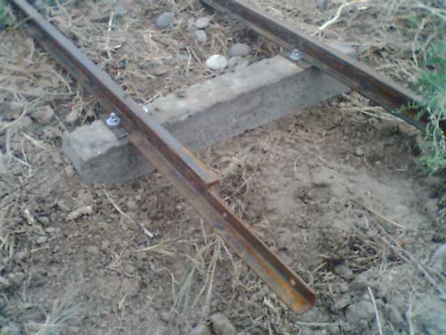 Concrete tie, tie plates, rail and joint system