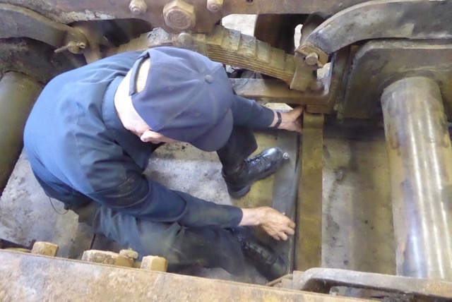 John Barret removes the two frame gauge bars.