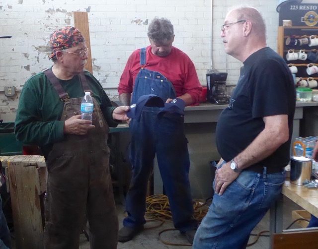 John and Larry receiving complimentary 223 caps from chairman Steve Jones