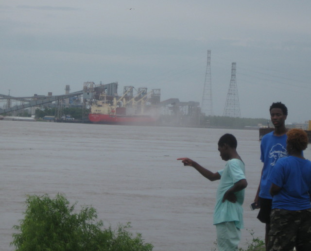 People on bank of Mississippi River in New Orleans, LA