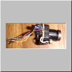 Close up of X-10 camera with wires removed from original mounting case.