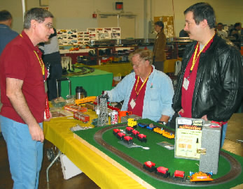 Hank, Walt and Jim man the sale tables