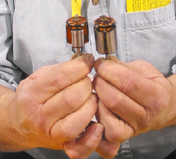 Bobs dainty hands hold two motors