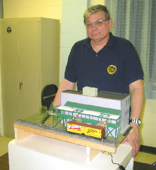 Joe Balcer shows of his Animated Ice House