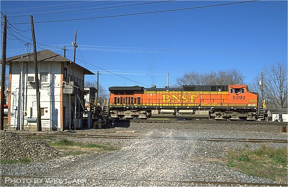 An eastbound BNSF train waits to pick up new paperwork at Tower 17. 