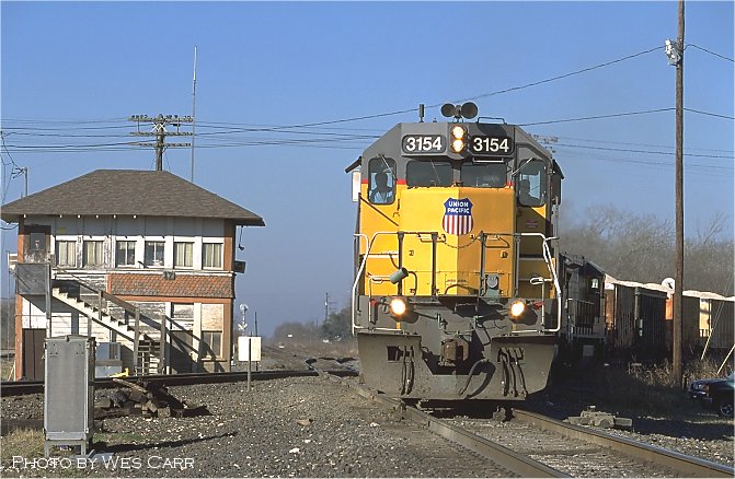 Eastbound UP rock train returns to UP trackage from BNSF rails at Tower 17