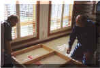 Bruce Fowler and Tom Regelein secure the table framing.