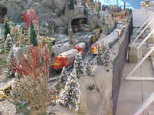 SantaFe locomotives heading up freight trains on The Garden Factory's holiday train display
