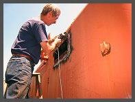 (c)2010 smph50 - Scott H. grinding down the welds on the replacement number board frame. (10K) - CLICK to Enlarge (100K)