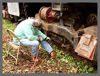(c)2011 smph50 - Society member Rick B. works the needle scaler on the engineer's side of the front truck. (10K) - CLICK to Enlarge (100K)