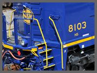 NS #8103 - GE ES44AC with white F near the steps of the cab. (10K)