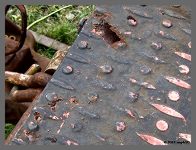 (c)2012 smph50 - Rust holes in the diamond plate. (10K) - CLICK to Enlarge (100K)