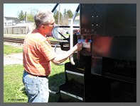 (c)2013 smph50 - Rick B. centers the vinyl letering on the frame. (10K) - CLICK to Enlarge (125K)