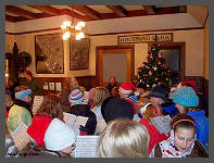 �2008 Robert Snyder - Carolers sing around the Christmas Tree. (10K) Click to ENLARGE (100K)
