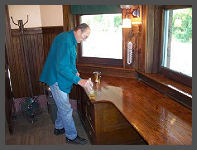 (c)2008 Robert Snyder - Gary L. applies a nice new coat of varnish to the station agent's desk. (10K)