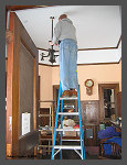(c)2008 Robert Snyder - Bob R. hangs a new fixture in the agent's office. (10K) - CLICK to Enlarge (100K)
