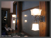 (c)2008 Robert Snyder - New reproduction Gas/Electric lighting fixtures on either side of the agent's window. (10K) - CLICK to Enlarge (100K)