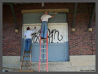 (c)2008 Robert Snyder - Painting and Priming the freight station doors. (10K) - CLICK to Enlarge (100K)