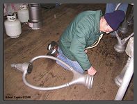 (c)2008 Robert Snyder - Gary L. works on the depot Harp Lamp fixtures. (10K) - CLICK to Enlarge (100K)