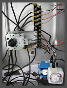 A Maytag Universal timer supplies continuous voltage to each bulb for about 15 minutes. An Intermatic timer turns the power supply and timer motor on twice a day. (c)2008 smph50 (10K) - CLICK to Enlarge (90K)