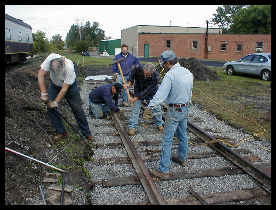 Rail being spiked down Click to ENLARGE (12K)-(55K)