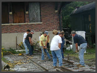 Laying the first pieces of rail. Click to ENLARGE (12K)-(50K)