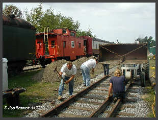 Caryl Youngers Tractor moves rail. Click to ENLARGE (12K)-(50K)