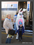 Mr Easter Bunny greets passengers boarding the train. - Click to ENLARGE (10K)-(60K)