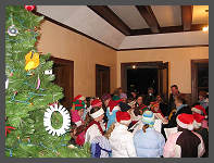 �2006 Robert Snyder - Carolers sing around the Christmas Tree. (10K) Click to ENLARGE (70K)